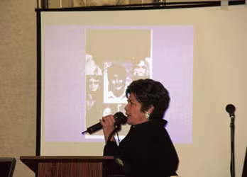 Anna Flowers speaks at a luncheon